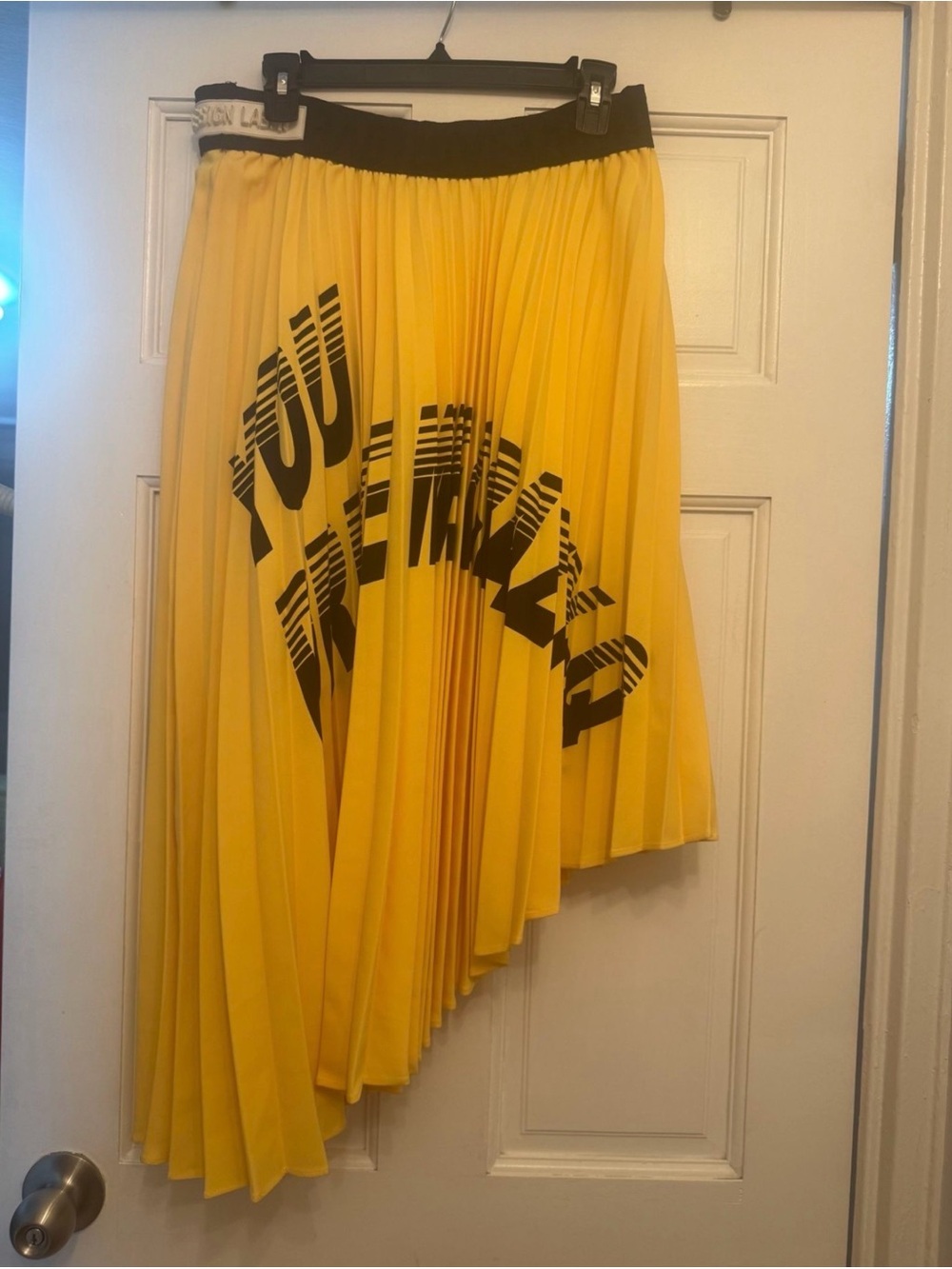Asymmetric Yellow Pleated Skirt with Black Graphic